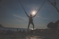 Active child in bungee jumping trampoline at sunset Royalty Free Stock Photo
