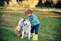 Active children concept. Boy and girl brother and sister traveling away from home. Children lovingly embraces his pet Royalty Free Stock Photo