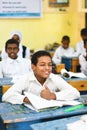 Active children making faces in classroom of Nubian school