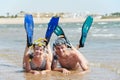 Active couple at sea beach with snorkel set Royalty Free Stock Photo