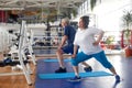 Active couple of seniors exercising at gym. Royalty Free Stock Photo