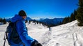 Active couple snow shoe hiking on a trail with scenic view on snow capped mountain peaks of Karawanks in Carinthia, Austria. Ski Royalty Free Stock Photo