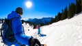 Active couple snow shoe hiking on a trail with scenic view on snow capped mountain peaks of Karawanks in Carinthia, Austria. Ski Royalty Free Stock Photo