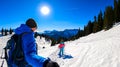 Active couple snow shoe hiking on a trail with scenic view on snow capped mountain peaks of Karawanks in Carinthia, Austria. Ski Royalty Free Stock Photo