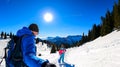 Active couple snow shoe hiking on a trail with scenic view on snow capped mountain peaks of Karawanks in Carinthia, Austria. Ski Royalty Free Stock Photo