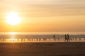 Active couple walking on beach at sunset Royalty Free Stock Photo