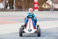 Active cute boy having fun with toy race cars Royalty Free Stock Photo