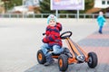 Active cute boy having fun with toy race cars Royalty Free Stock Photo