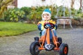 Active cute boy having fun with toy race cars Royalty Free Stock Photo