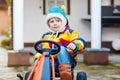 Active cute boy having fun with toy race cars Royalty Free Stock Photo