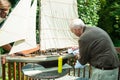 Active Elderly Man and Son with Model Boat Royalty Free Stock Photo