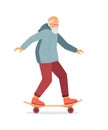 Active energetic happy gray haired elderly adult man skateboarding. Senior male finding a new hobby having fun enjoying riding