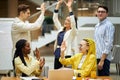 Active enthusiastic business team giving high five Royalty Free Stock Photo