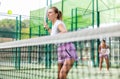 European woman padel tennis player trains on the outdoor court Royalty Free Stock Photo