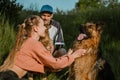Active Family, fitness couple, Pet Love, Dog Training, best dog breeds for family. Young sports couple walking with two Royalty Free Stock Photo