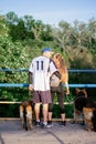 Active Family, fitness couple, Pet Love, Dog Training, best dog breeds for family. Young sports couple walking with two Royalty Free Stock Photo