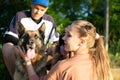 Active Family, fitness couple, Pet Love, Dog Training, best dog breeds for family. Young sports couple walking with two Royalty Free Stock Photo