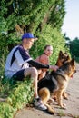 Active Family, fitness couple, Pet Love, Dog Training, best dog breeds for family. Young sports couple walking with two Royalty Free Stock Photo