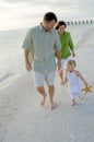 Active family playing on beach Royalty Free Stock Photo