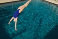 Active Female Swimmer Diving