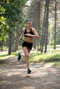 Active fir girl running single in park, summer, healthy, perfect tone body, fit. Workout in the park