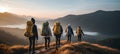 Active fit lifestyle couples helping each other hike up a stunning mountain at sunrise in asia Royalty Free Stock Photo