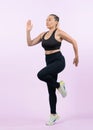 Active and fit senior woman in sportswear portrait in running posture. Clout Royalty Free Stock Photo