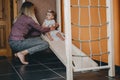 Active games for Baby indoors activities. Toddler girl play with mom on home Wooden playsets. Play Gym, Home and School Royalty Free Stock Photo