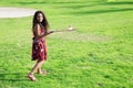 Active girl playing badminton in outdoor court in summer Royalty Free Stock Photo