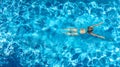 Active girl in swimming pool aerial drone view from above, young woman swims in blue water, tropical vacation, holiday on resort Royalty Free Stock Photo