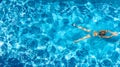 Active girl in swimming pool aerial drone view from above, young woman swims in blue water, tropical vacation, holiday on resort Royalty Free Stock Photo