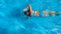 Active girl in swimming pool aerial drone view from above, young woman swims in blue water, tropical vacation, holiday on resort Royalty Free Stock Photo