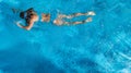 Active girl in swimming pool aerial drone view from above, young woman swims in blue water, tropical vacation, holiday on resort Royalty Free Stock Photo