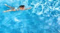 Active girl in swimming pool aerial drone view from above, young woman swims in blue water, tropical vacation, holiday on resort Royalty Free Stock Photo