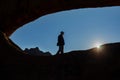 Active girl travels in Spitzkoppe nature reserve, woman traveler hiking near stone arches and famous rock formations in Namibia