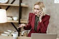 Active good-looking woman solving business moments throughout phone call