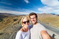 Active happy couple taking selfie on travel in high Atlas mountains, Ouarzazate, Morocco.