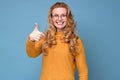 Active happy mature woman in glasses showing thumb up approving your choice. Royalty Free Stock Photo