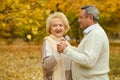 Active seniors on a walk in autumn forest Royalty Free Stock Photo