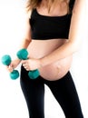 Active healthy pregnant woman exercising with dumbells, isolated on white background