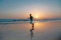 Active healthy runner jogging outdoor. Young and active jogger running on beach sunset. Royalty Free Stock Photo