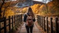 Active hiker woman walking on beautiful forest hike trail in autumn fall nature background