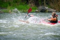 Active kayakers on the rough water.