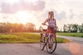 Active life. A young woman with cycling at the sunset in the park. Bicycle and ecology concept Royalty Free Stock Photo