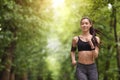 Active Lifestyle. Motivated Sporty Girl Jogging In Green Summer Park Royalty Free Stock Photo