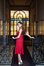 Active lifestyle. Sensual smile. Beautiful brunette young woman wearing dress and walking on the street. Fashionable Royalty Free Stock Photo