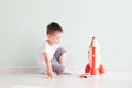 Active little boy playing the rocket toys, Child showing rocket toy with happy face, Children or Toddler learning and Royalty Free Stock Photo