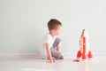 Active little boy playing the rocket toys, Child showing rocket toy with happy face, Children or Toddler learning and Royalty Free Stock Photo