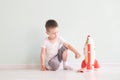 Active little boy playing the rocket toys, Child showing rocket toy with happy face, Children or Toddler learning and Royalty Free Stock Photo