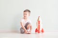 Active little boy playing the rocket toys, Child showing rocket toy with happy face, Children or Toddler learning and Royalty Free Stock Photo